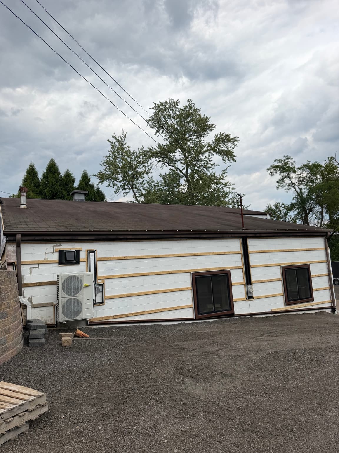 Existing side wall and roof during exterior preparation