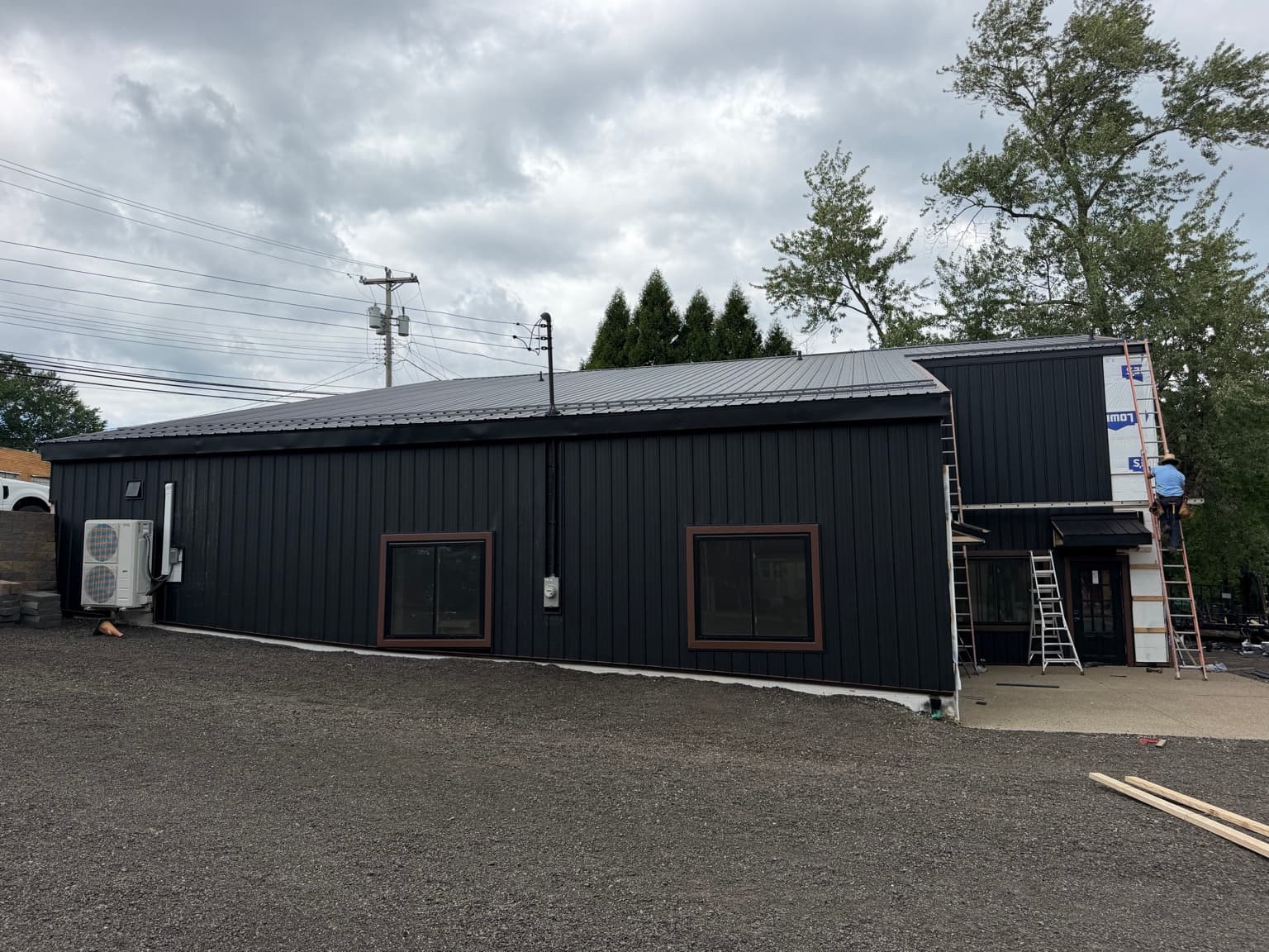 Near-complete metal roofing and coordinated metal siding